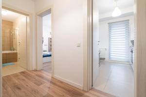 a hallway with a door leading to a bathroom at 21 Residence Studio in Bucharest +190 photos