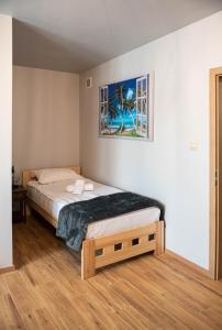 Кровать или кровати в номере Przystań