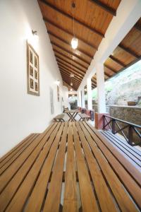 a room with wooden flooring and a wooden ceiling at The Montfort, Nuwaraeliya in Nuwara Eliya