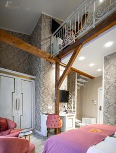 a bedroom with a loft bed and a staircase at Queen Palace in Novi Sad