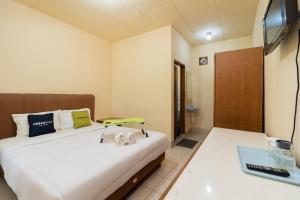 TV/Unterhaltungsangebot in der Unterkunft Urbanview Hotel Griya Astoeti 2 Cisarua Puncak