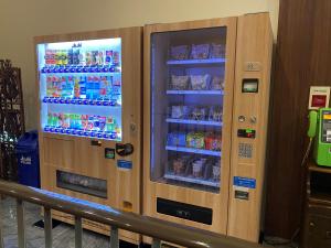 two vending machines with food and drinks in them at Hotel New Gaea Omuta Garden in Ōmuta