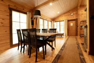 a dining room with a table and chairs at Ruhnu Holiday House in Ruhnu +13 photos