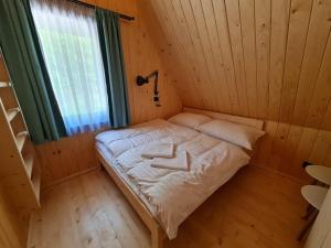 Postel nebo postele na pokoji v ubytování Chaty Tri vydry
