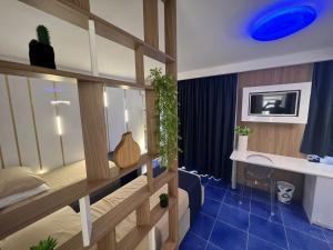 a bedroom with a bunk bed with a blue ceiling at Residenza AquaLaguna in Tropea