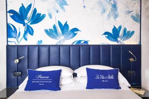 A bed or beds in a room at UNAHOTELS Imperial Sport Hotel