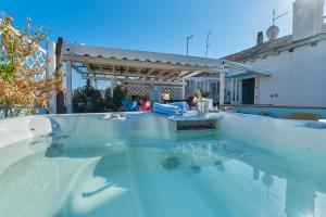 a swimming pool with blue water in a house at Mare Mare Suites in Mali Lošinj