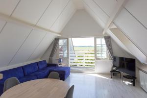 Ein Sitzbereich in der Unterkunft Hello Zeeland - Appartement Brouwerijweg 43-1