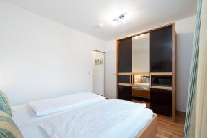 Postel nebo postele na pokoji v ubytování Wohnpark am Mühlenteich - Appartement 27