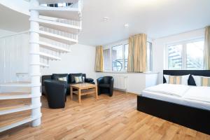 Postel nebo postele na pokoji v ubytování Wohnpark am Mühlenteich - Appartement 27