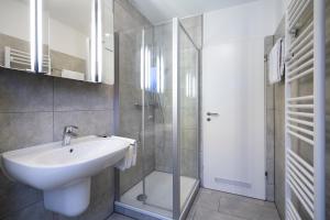 Koupelna v ubytování Wohnpark am Mühlenteich - Appartement 27 + 28 fotografií