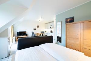 Postel nebo postele na pokoji v ubytování Wohnpark am Mühlenteich - Appartement 24