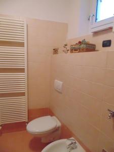 a bathroom with a toilet and a sink at Cà Del Polsèt in Brenzone sul Garda