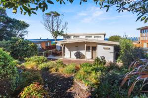 a house with a garden in front of it at Otway Views in Apollo Bay