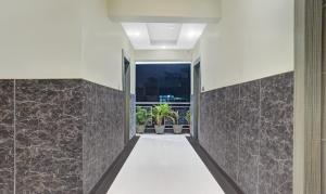 a hallway of a house with stone walls at Itsy Hotels Cradle Regency in Rānchī