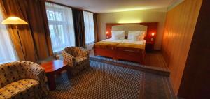 Postel nebo postele na pokoji v ubytování Hotel Okresní Dům