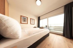 Posteľ alebo postele v izbe v ubytovaní Apartment Alpenblick