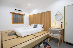 En eller flere senge i et værelse på Villa Sunrise Garden A180 + 37 billeder