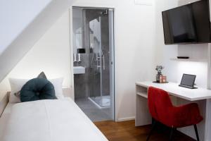 Postel nebo postele na pokoji v ubytování Reos Hotel Wangen