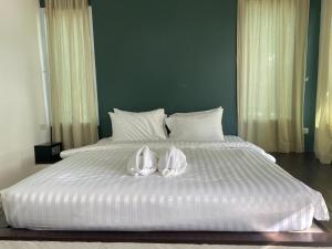 Postel nebo postele na pokoji v ubytování White house bailan resort