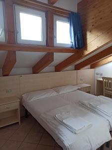 Postel nebo postele na pokoji v ubytování Villa San Carlo