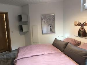 a living room with a couch and a mirror at Ferienappartement Greiff in Könen