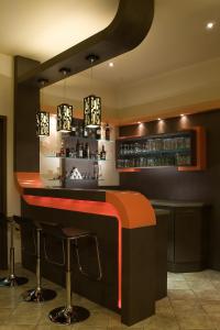 The lounge or bar area at Alfa Hotel