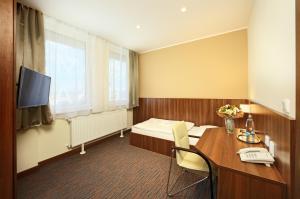 TV a/nebo společenská místnost v ubytování Congress Hotel Centrum