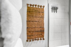 a shower with a wicker shower curtain in a bathroom at Central Castle House in Norwich