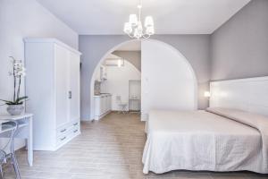 En eller flere senge i et værelse på Residenza Le Zagare