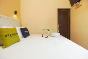 Postel nebo postele na pokoji v ubytování Urbanview Hotel Cantee Halim Perdanakusuma by RedDoorz