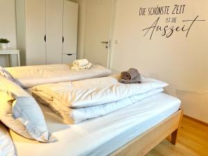 A bed or beds in a room at Appartements BERGTRAUM