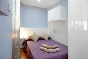A bed or beds in a room at Atico Las Vegas