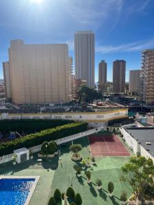 a view of a city with a pool and buildings at Domo 5E Holiday apt with pool in Benidorm