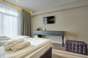 Letto o letti in una camera di Olimp Hotel