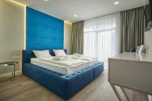 Letto o letti in una camera di Olimp Hotel