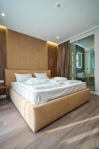 Letto o letti in una camera di Olimp Hotel