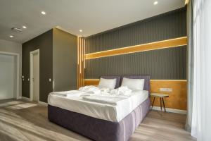Letto o letti in una camera di Olimp Hotel