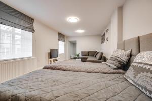 Ένα ή περισσότερα κρεβάτια σε δωμάτιο στο Central Platinum Apartments 19