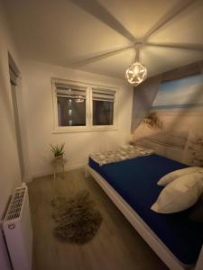 Postel nebo postele na pokoji v ubytování Widok na Morze Porta Mare - Apartament 339