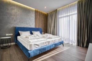Letto o letti in una camera di Olimp Hotel