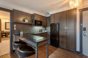 Kuchyň nebo kuchyňský kout v ubytování Best Western Plus Village Park Inn