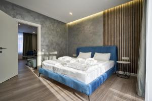 Letto o letti in una camera di Olimp Hotel