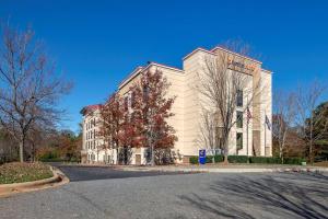 a large white building on the side of a street at Comfort Suites Lake Norman - Huntersville in Huntersville