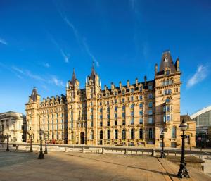 a large building in a city with a blue sky at Radisson RED Hotel, Liverpool in Liverpool