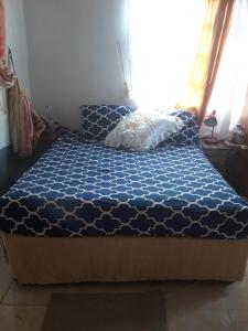 A bed or beds in a room at Cocoa Cabana