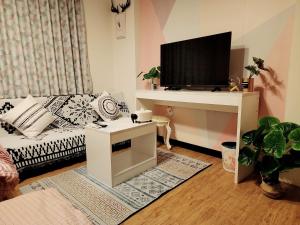 TV a/nebo společenská místnost v ubytování 樂南居