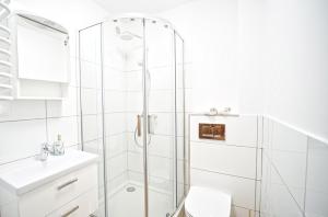 Kúpeľňa v ubytovaní Apartamenty EverySky Nad Łomnicą 15-15A