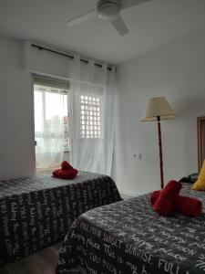 A bed or beds in a room at Precioso alojamiento junto al Mediterráneo