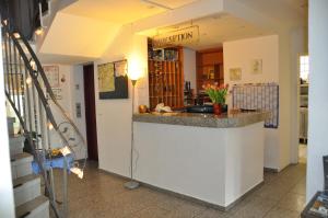 a kitchen with a sink and a counter top at Hotel Hornung in Darmstadt